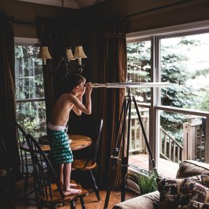 Boy with a telescope by Teddy Kelly