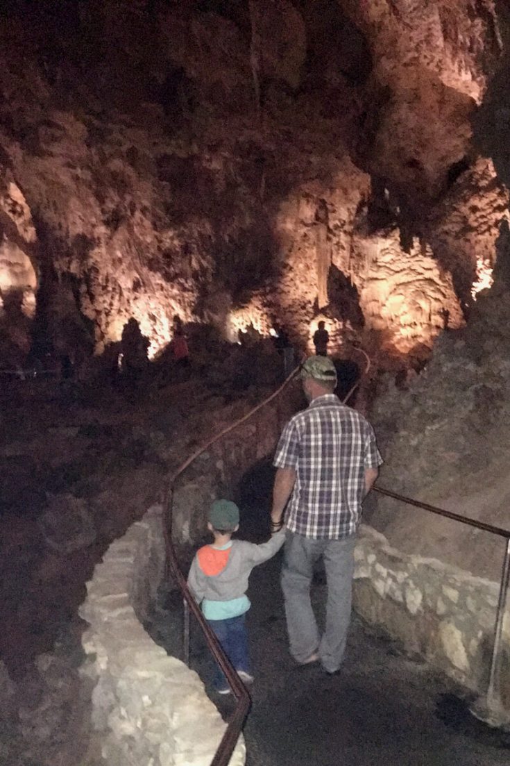 Son and dad walking in Carlsbad Caverns