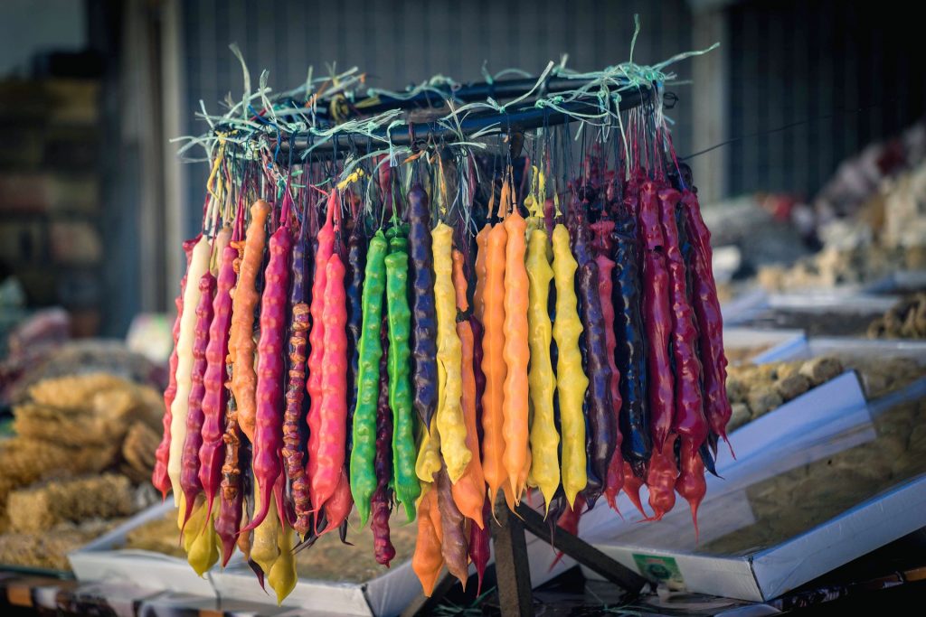 Churchkhela (stringed nuts dipped in grape juice and flour/corn flour mixture and dried) in various colors, Tbilisi