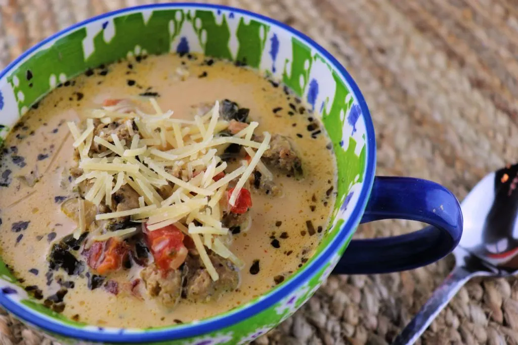 The perfect low carb dinner. Creamy keto Italian sausage soup is easy and comforting. #lowcarbsoup #souprecipes