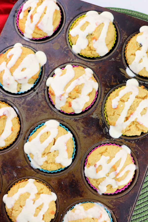 Low carb breakfast muffins overhead with cream cheese drizzle #ketomuffins #ketobreakfast