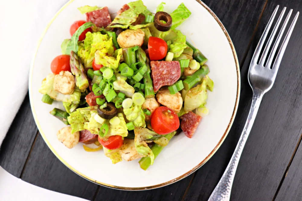 Antipasto Salad is full of flavor and a great keto or low carb lunch! Take it to your next picnic or potluck and voilà! The perfect gluten-free salad option. #ketolunch #lowcarbsalad