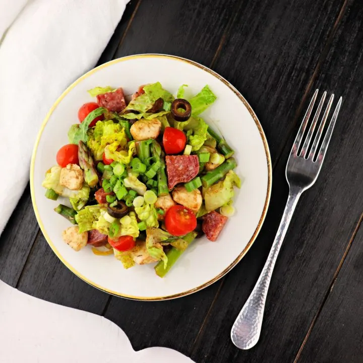 Keto Antipasto Salad with fresh veggies, mozzarella, and sausage is the perfect low carb lunch or addition to any picnic or party. #ketosalad #lowcarbsalad