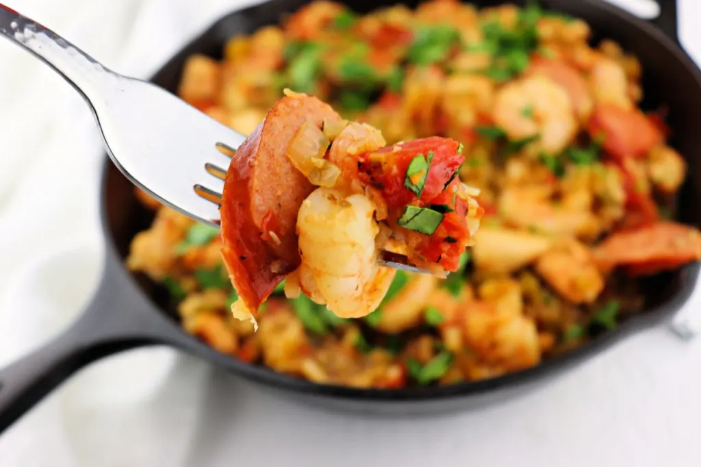 A bite of keto jambalaya will have you wanting more. Gluten-free and low carb, a spicy one-pot meal. #lowcarbrecipes #ketocajun