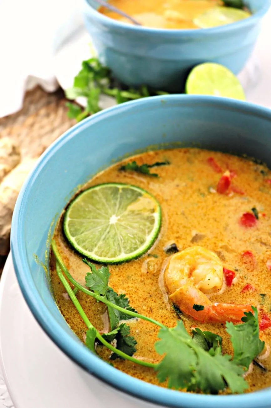 Keto Low Carb Thai Coconut Soup is full of flavors while still gluten-free and dairy-free. Shrimp, ginger, lime, red curry, perfectly refreshing for spring. #ketosoup #lowcarbdinner