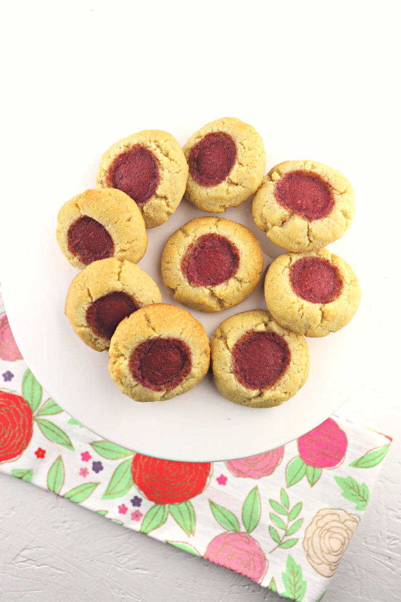 Low carb keto thumbprint cookies are absolutely melt-in-your mouth low carb delish. The perfect gluten-free, sugar-free kid-friendly cookie for all the holidays. #ketoholidays #lowcarbrecipes
