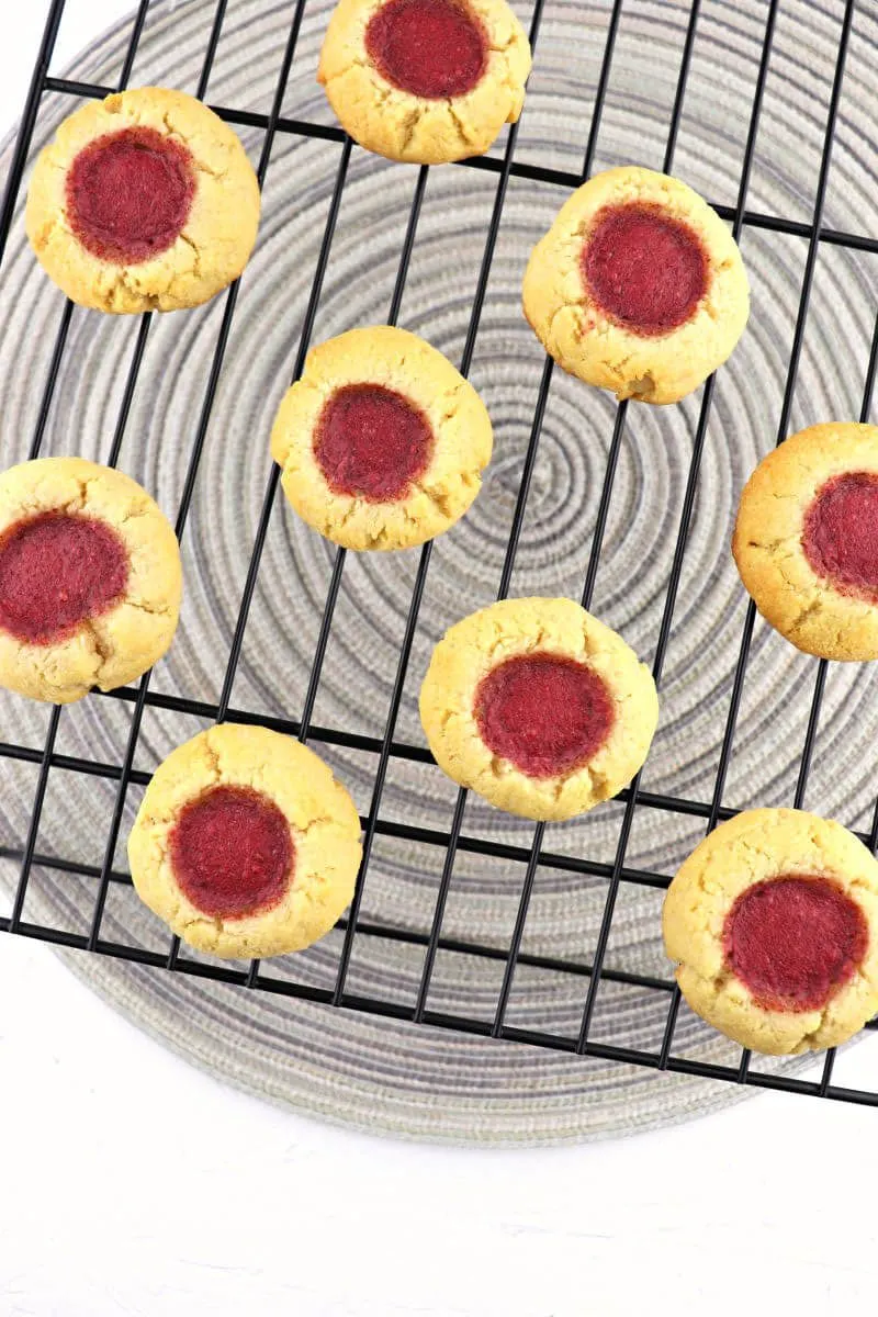 Traditional butter and jam thumbprint cookies are a low carb holiday staple! Christmas, Easter, or the Fourth of July, these kid-friendly gluten-free cookies will disappear fast. #ketocookies #lowcarbcookies