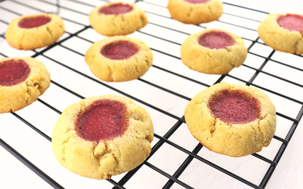 Butter and jam keto thumbprint cookies are a delicious low carb party in your mouth. Gluten-free, sugar-free and perfect for snacks, picnics, or special occasions. #lowcarbrecipes #ketorecipes