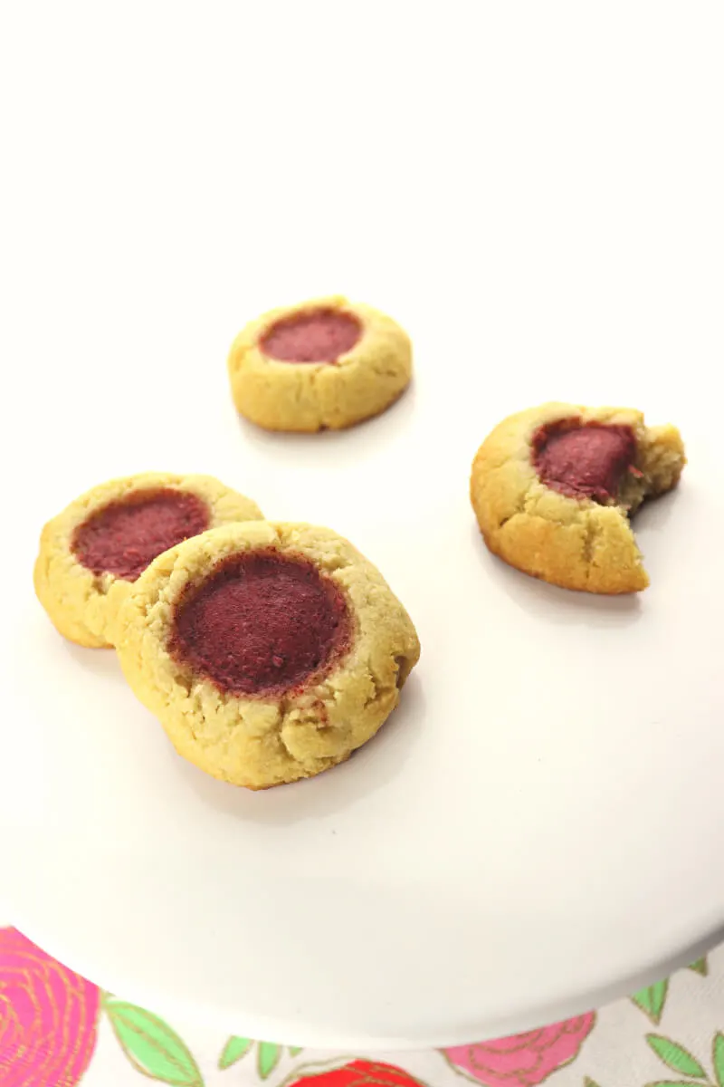 Low carb keto thumbprint cookies with sugar-free strawberry jam are the perfect gluten-free holiday cookie. Easy and kid-friendly, a great choice for picnics and parties. #ketorecipes #lowcarbcookies