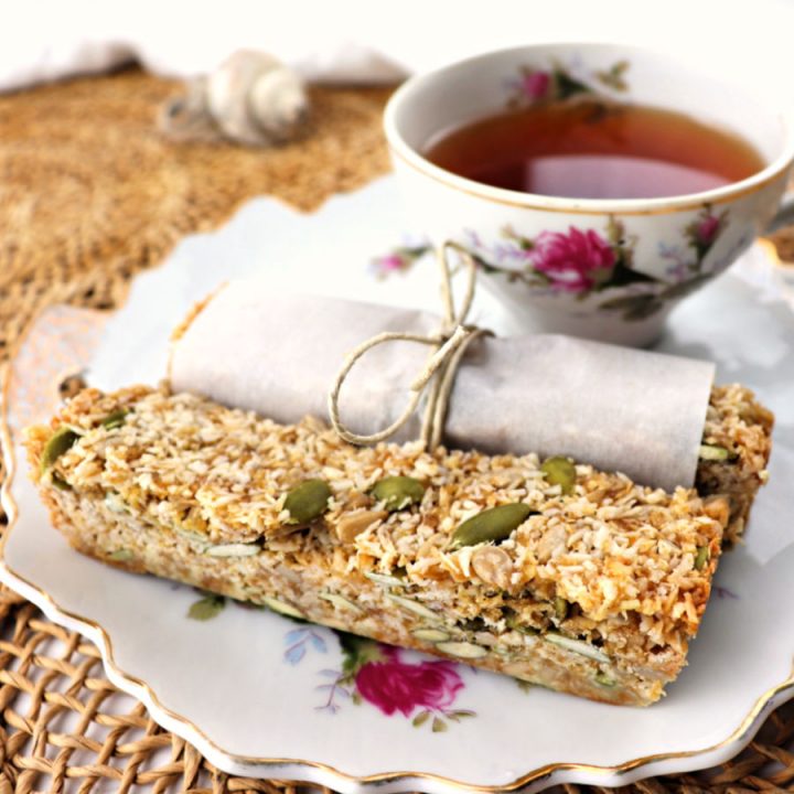 Low carb coconut granola bars are coconut, maple, and pumpkin seed goodness. Perfect keto breakfast or snack for on the go. Gluten-free and sugar-free! #lowcarbgranolanar #lowcarbrecipes