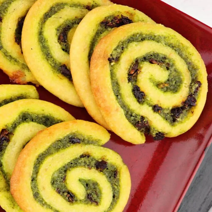 Keto pesto pinwheels are a fun and flavorful low carb snack. Perfect for parties and game days. #ketosnacks #ketorecipes