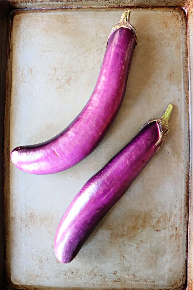 Two Chinese eggplants on a pan