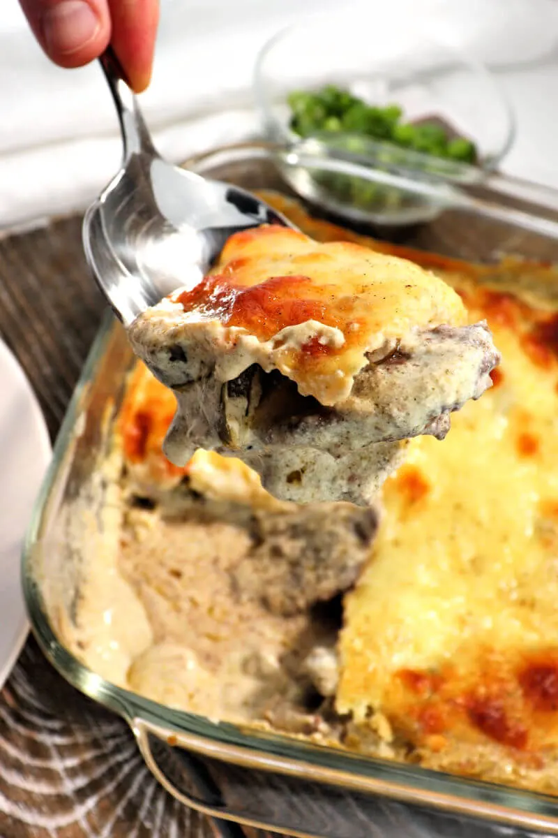 Spoon of delicious keto Philly cheesesteak casserole. Perfect to meal prep for weeknight family low carb dinners. #lowcarbdinner #ketorecipes