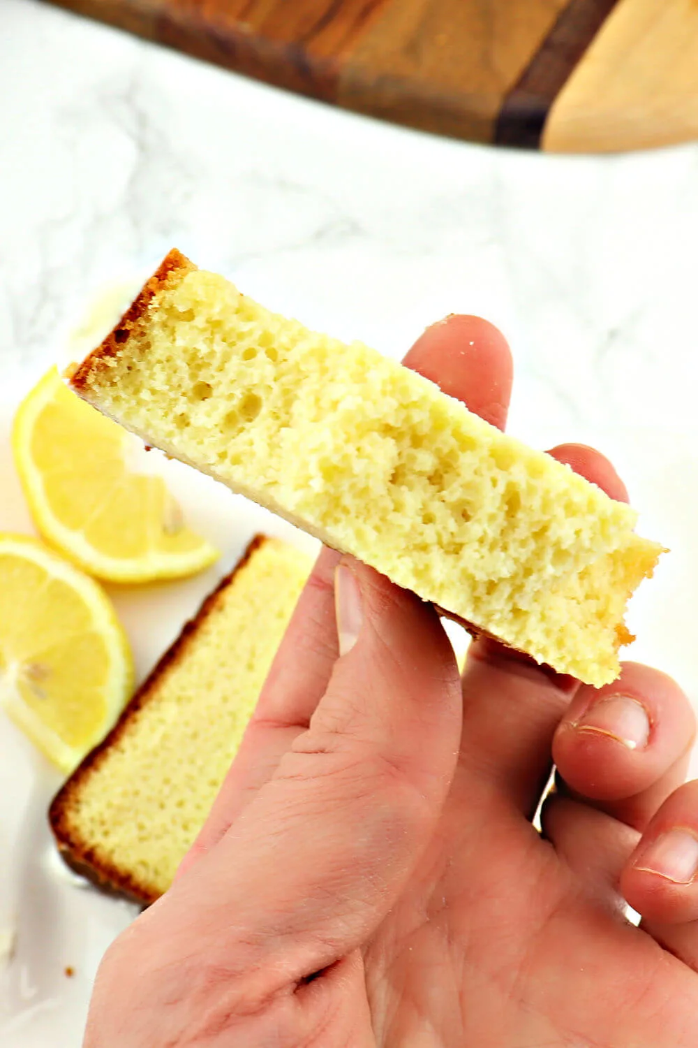 This flavorful keto lemon pound cake recipe is the perfect low carb recipe for a gluten-free high tea or a protein packed breakfast. Easy and tangy, have a slice with your coffee or for a fabulous keto dessert. #ketopoundcake #ketobreakfast #ketodessertrecipes #lowcarbdesserts