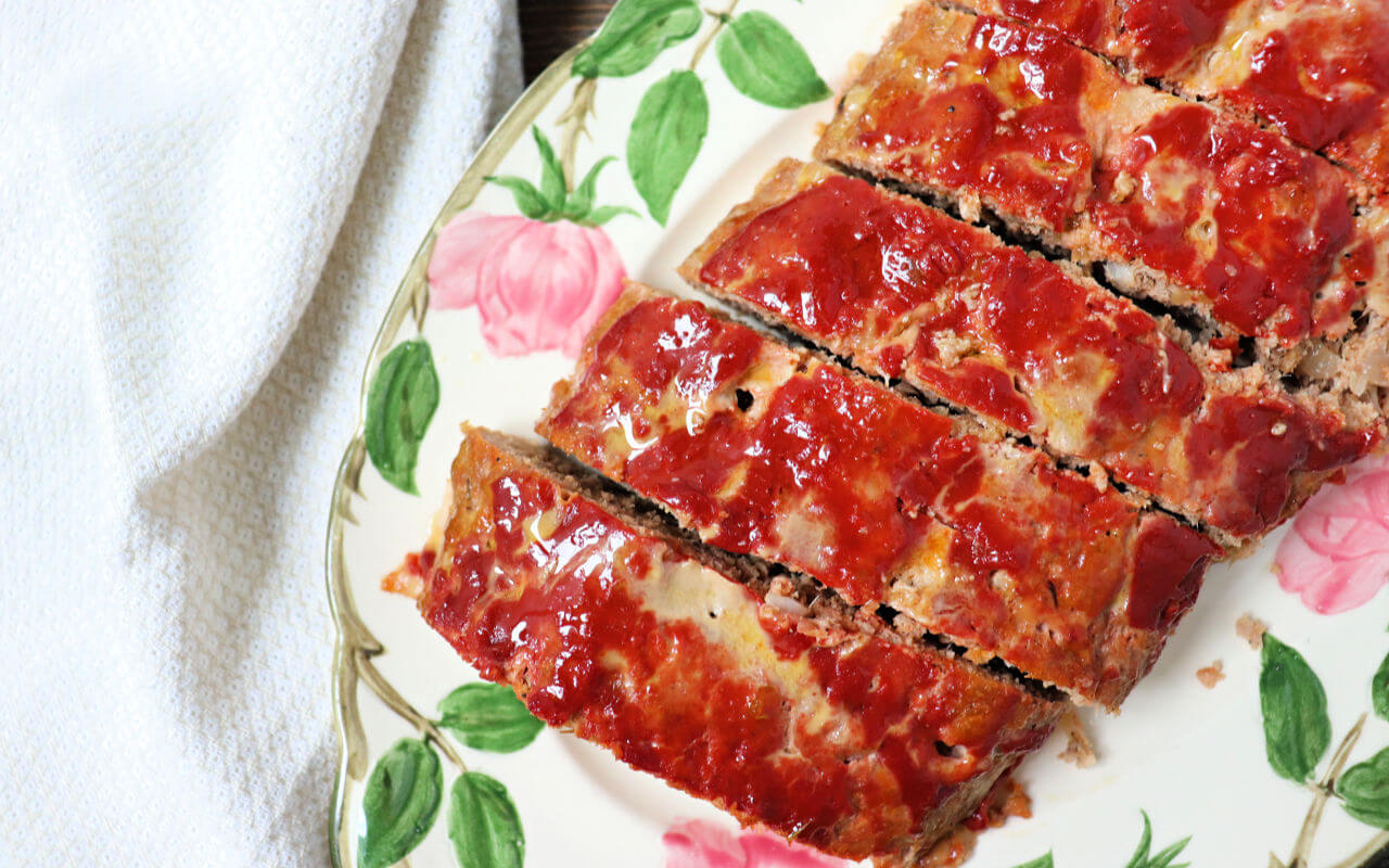 Low carb keto turkey meatloaf is a gluten-free family recipe treat. Moist and full of flavor, it's the best kind of comfort food. #ketorecipes #lowcarbdinner