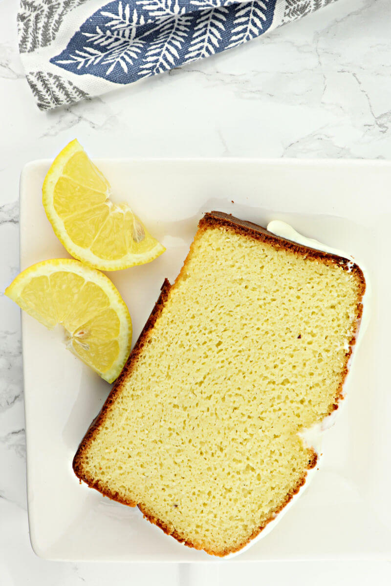A piece of lemon keto pound cake is the perfect low carb breakfast or gluten-free dessert. #lowcarbdesserts #lowcarbdessertsketo