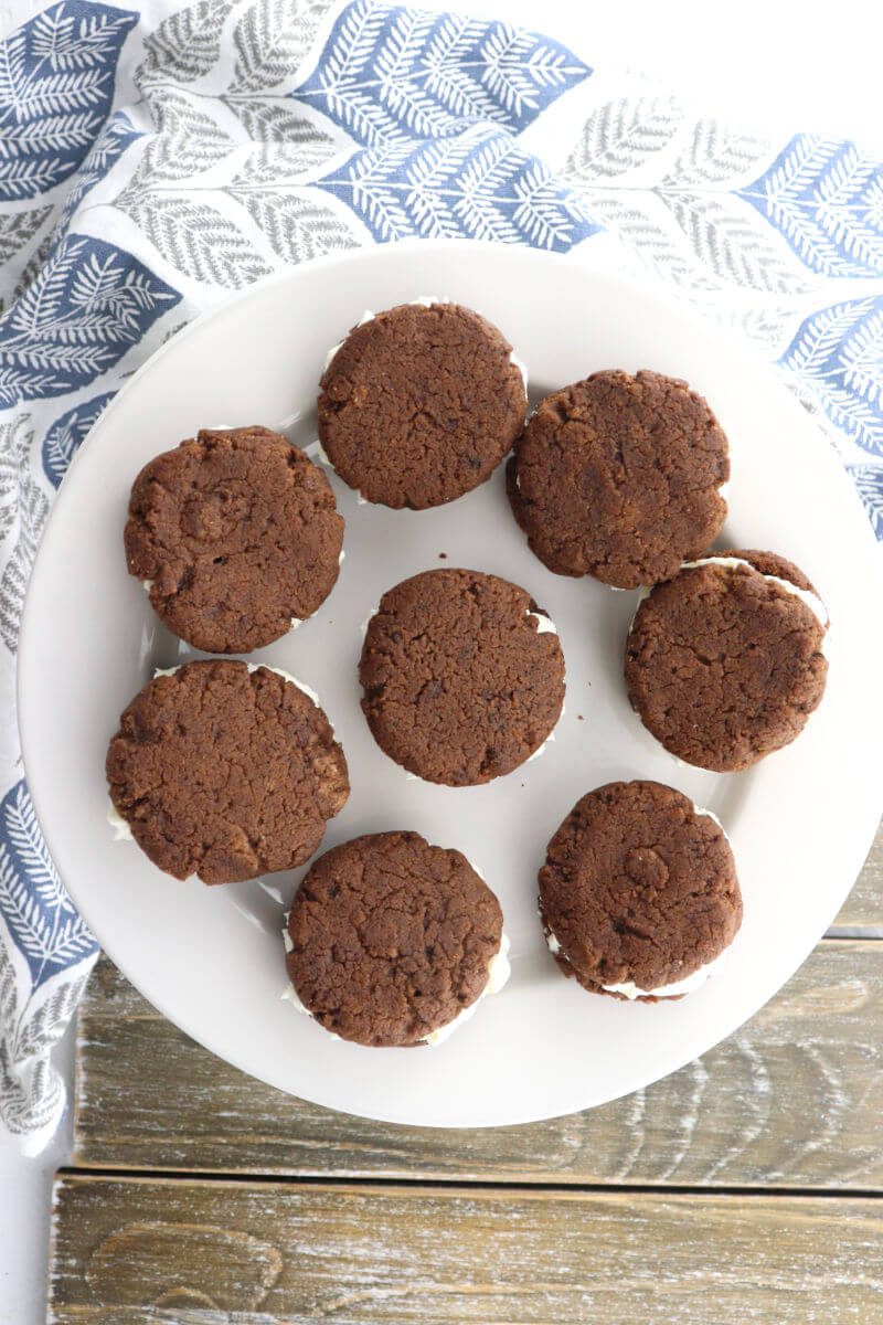 Soft and delicious keto chocolate sandwich cookies are a mix between keto oreos and keto whoopie pies. Gluten-free and sugar-free with a cream cheese filling, the result is perfect for a keto diet. #ketocookies #ketodesserts