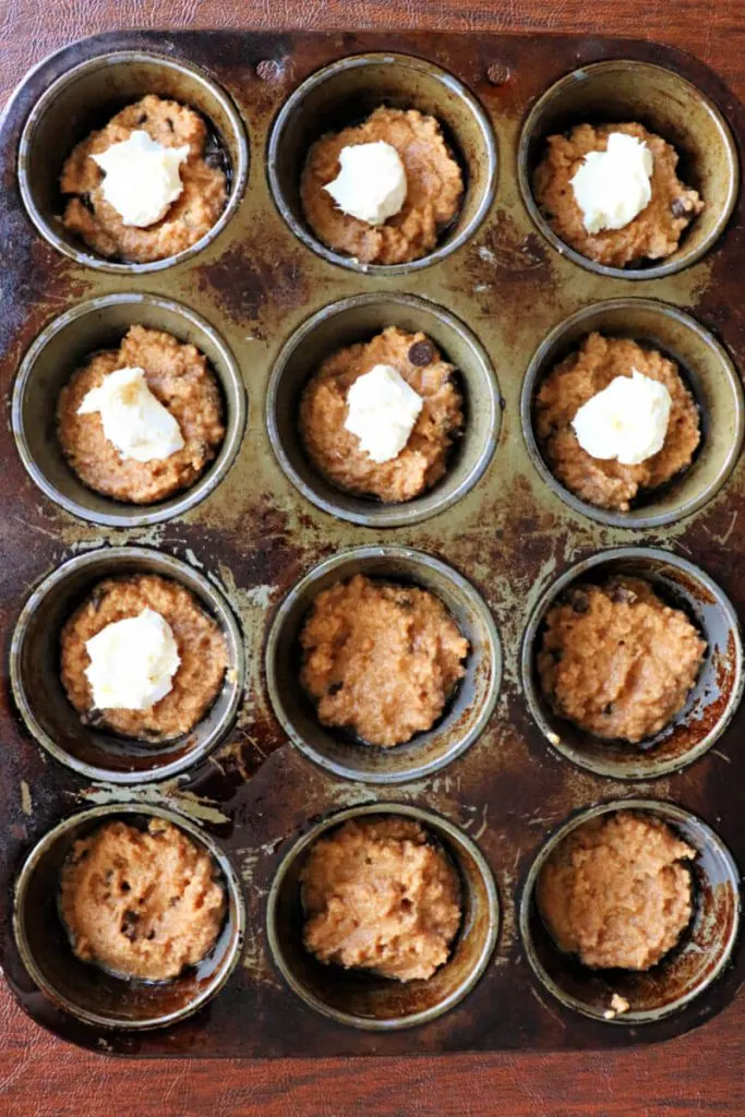 Cream cheese filling makes a divine keto pumpkin muffin! These low carb babies make a delicious grab-and-go sugar-free breakfast, perfect for fall or anytime! #ketorecipes #pumpkinspice #lowcarbpumpkin