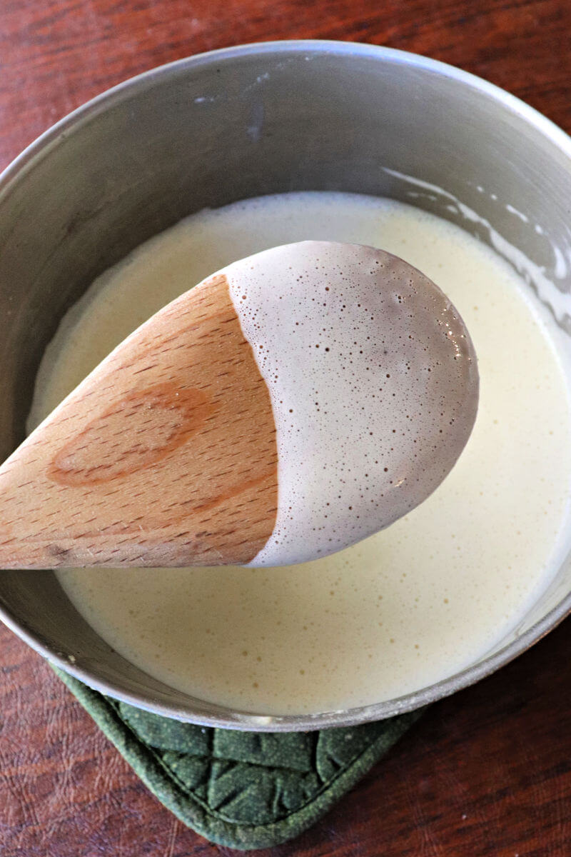 Eggnog custard coats the back of a spoon. #ketoeggnog #ketorecipes