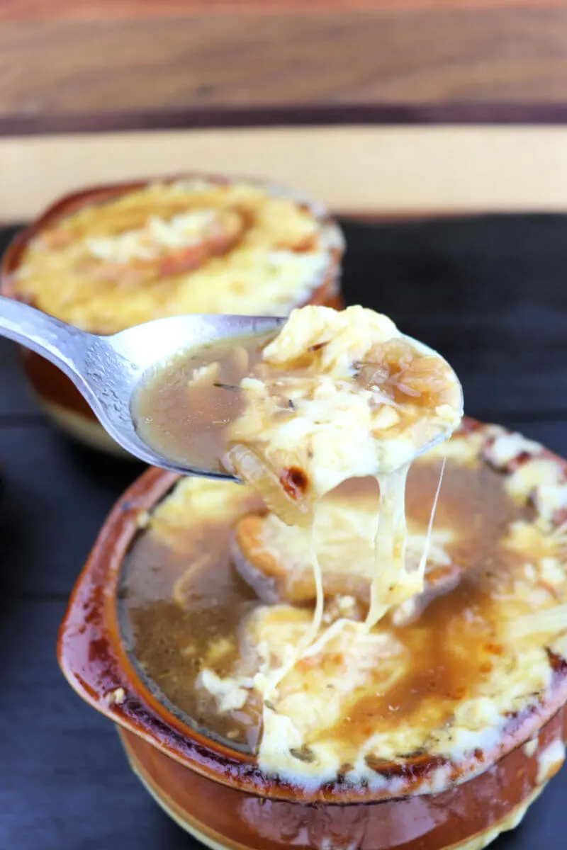 Bite of keto French onion soup with gruyere cheese and garlic crostini. #ketorecipes #ketosouprecipes #lowcarbsoups