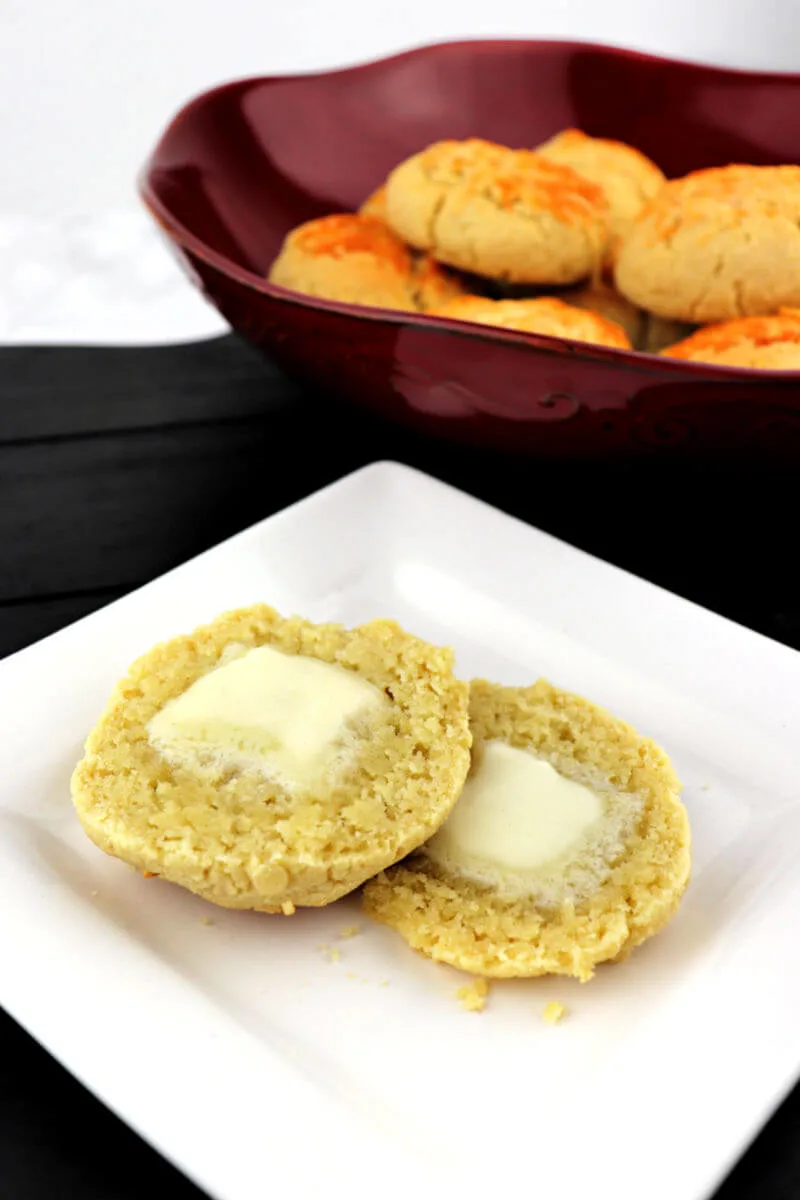 Keto biscuits with butter are gluten-free and packed with garlic and parmesan flavor. #ketobread #lowcarbrecipes