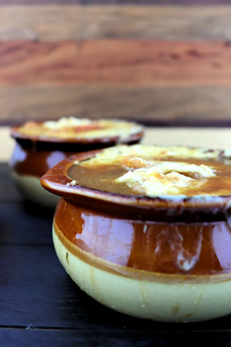 Keto French Onion Soup from the side with gruyere and garlic crostini #ketosouprecipes #ketorecipes #lowcarbsoup