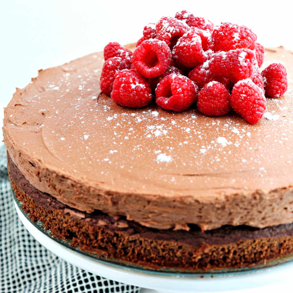 Keto chocolate mousse cake is divinely decadent yet gluten-free and sugar-free. Perfect for a holiday dessert or special occasion. #ketodessert #ketochristmas #lowcarbcake