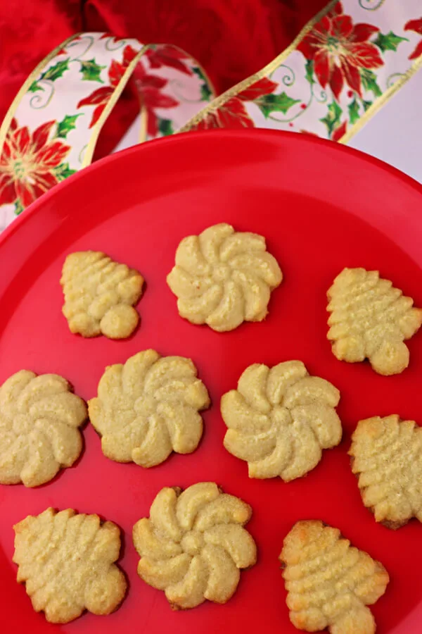 Keto Butter Spritz Cookies are the perfect Keto Christmas cookies. Soft and buttery gluten-free goodness. #ketocookies #ketochristmas