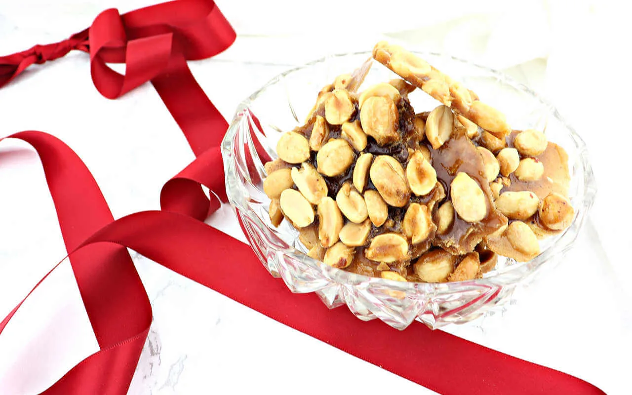 A holiday low carb candy reminiscent of childhood Christmases, keto peanut brittle is salty and sweet and delicious. #ketocandy #ketodesserts #lowcarbsnacks