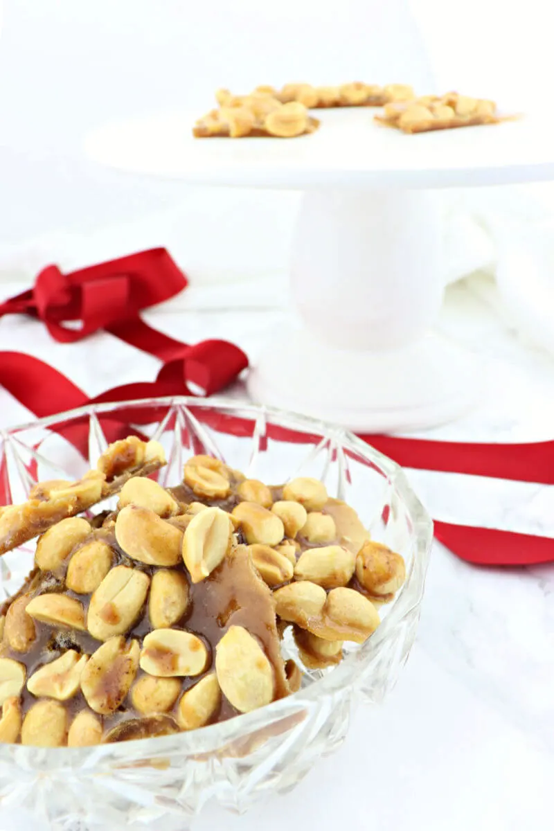 Easy keto peanut brittle will be a hit at your next low carb holiday party. Sugar-free and gluten-free with the taste of peanut salty sweet of childhood. #ketorecipes #lowcarbcandy #sugarfreepeanutbrittle