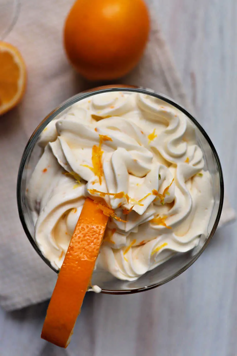 Creamy keto lemon mousse is the perfect burst of cream and citrus with a gluten-free toasted almond crunch. #ketodessertrecipes #ketorecipes #lowcarbdesserts