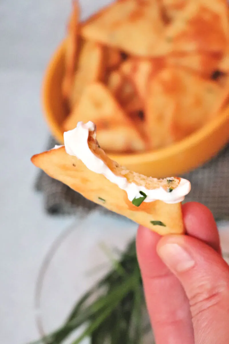 Bite out of a sour cream and onion keto chip. So good and gluten-free, potato-free, and low carb. #ketorecipes #ketochips