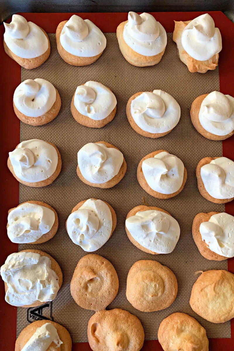 Keto meringue cookies topped with whipped cream. #ketocookies #ketorecipes #ketodesserts