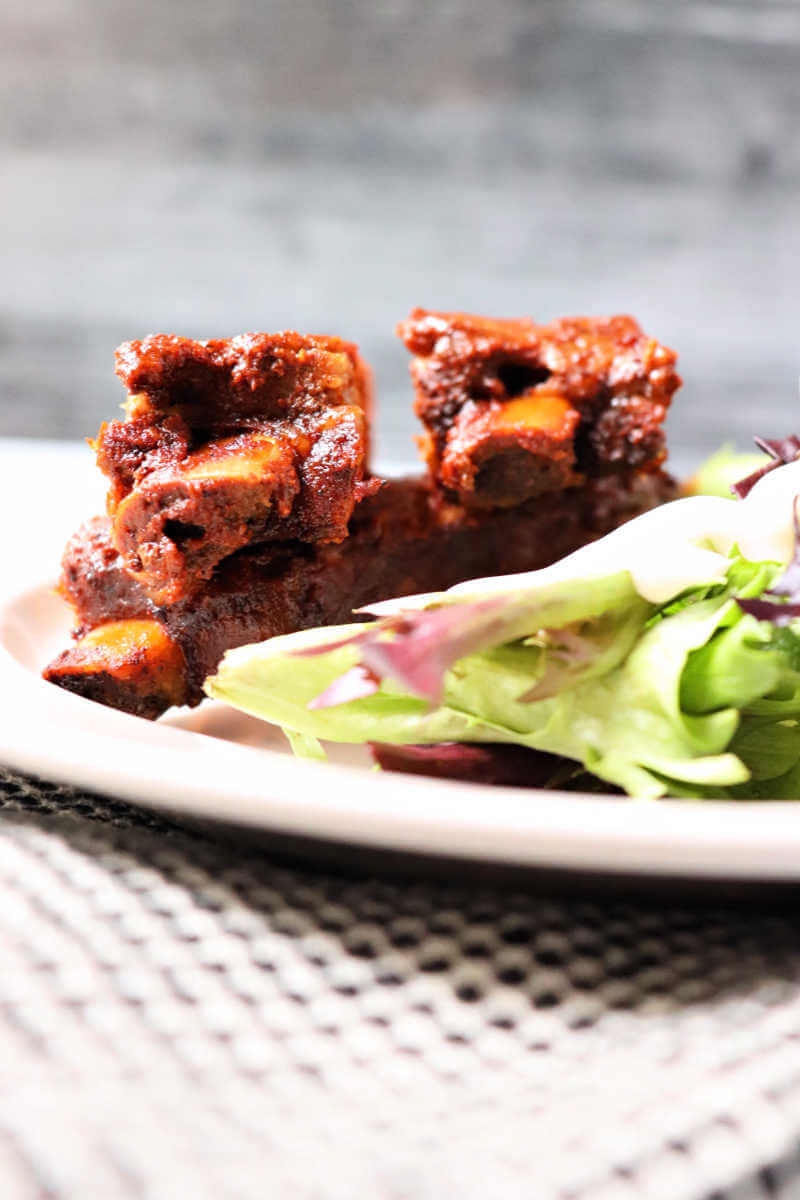 Sides of pork ribs with keto rib rub and a salad. #ketodinner #ketoporkrecipes #ketoribrub