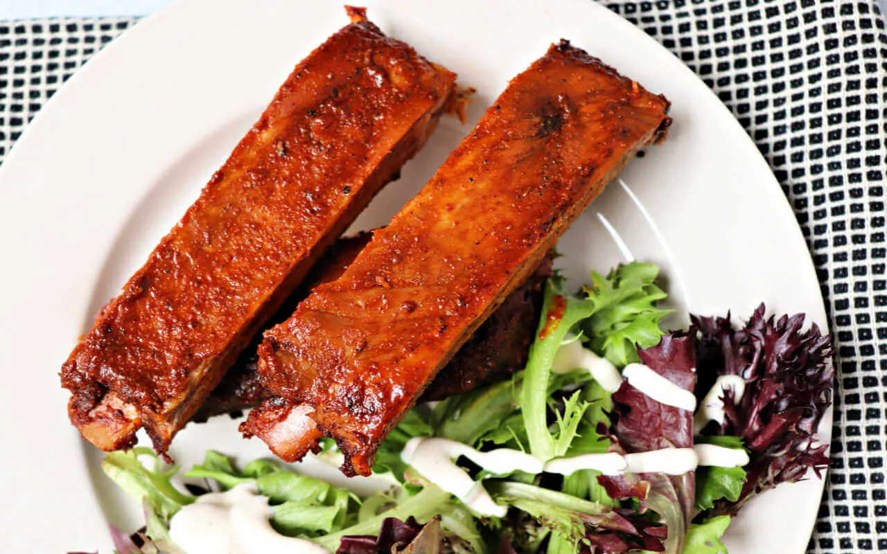 Low carb pork ribs with keto rib rub are a delicious blast to my southern past. Southern-style gluten-free spices with ooey-gooey pork joy. #ketorecipes #ketodinners #lowcarbribs