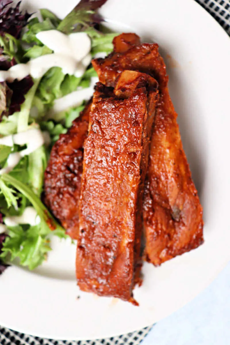 Keto pork ribs are perfectly cooked with a dry rib rub and keto BBQ sauce. #ketodinner #ketorecipes #lowcarbrecipes