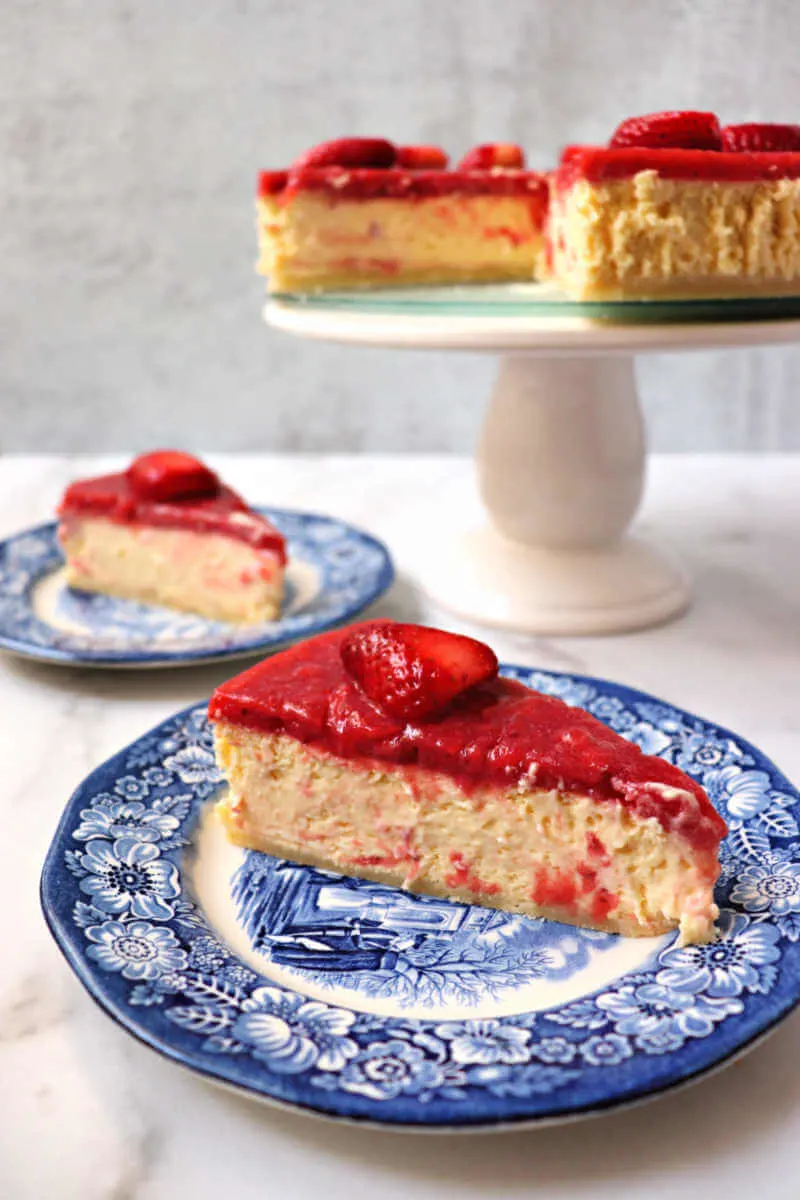 Creamy keto strawberry cheesecake is perfect for Valentine's Day or any special event. A low carb almond flour crust, then silky-smooth keto cheesecake, with a sugar-free strawberry topping. #ketocheesecake #ketodessert #ketolicious