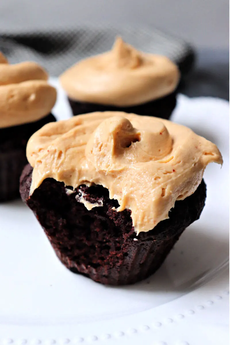Creamy keto peanut butter frosting on a low carb chocolate cupcake. #ketorecipes #ketofrosting #ketobirthdaycake
