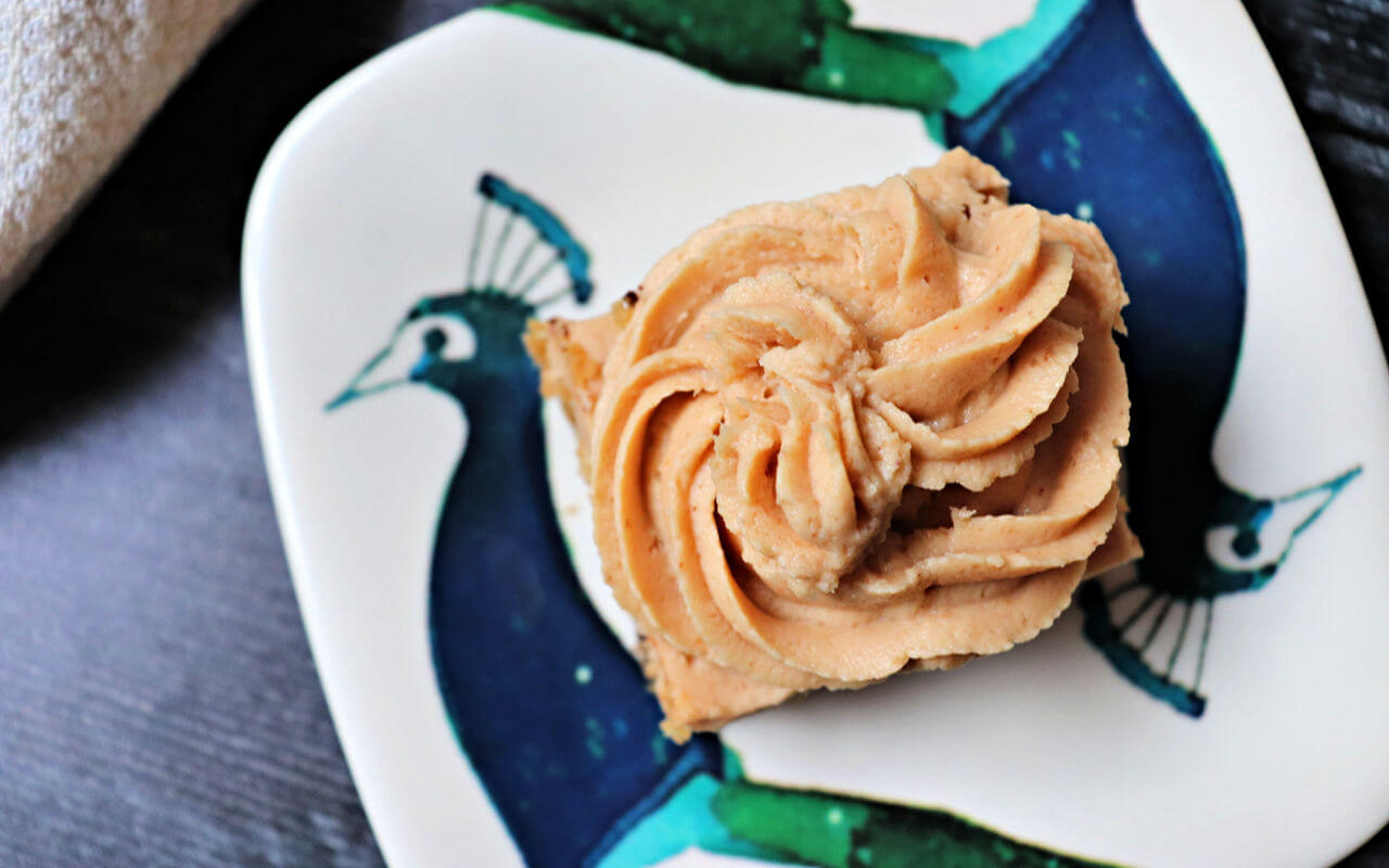 Delicious keto peanut butter frosting is good on just about anything. Sugar-free, gluten-free, creamy and perfect for a low carb keto diet. #ketofrosting #ketorecipes #ketodesserts
