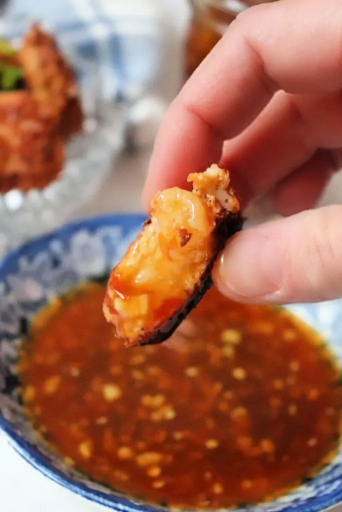 Bite of keto coconut shrimp with sweet chili sauce. #ketodinners #ketoshrimprecipes