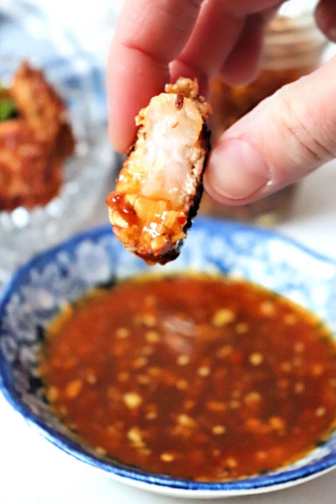 Shrimp dipped in keto sweet chili sauce. Asian-inspired sugar-free dipping sauce for meats, shellfish, and more! #ketorecipes #ketosauces