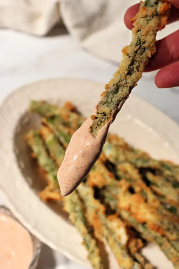 Keto asparagus fry dipped in spicy low carb garlic dip.