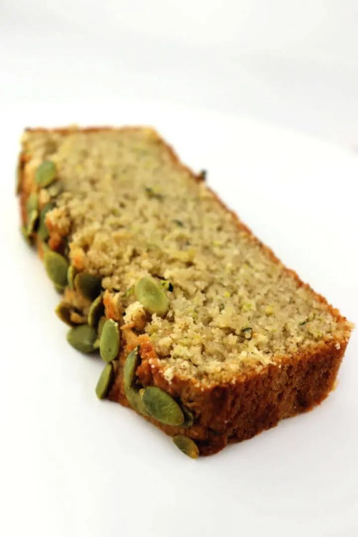 One piece of the best ever keto zucchini bread. Low carb, gluten-free, sugar-free delicious.