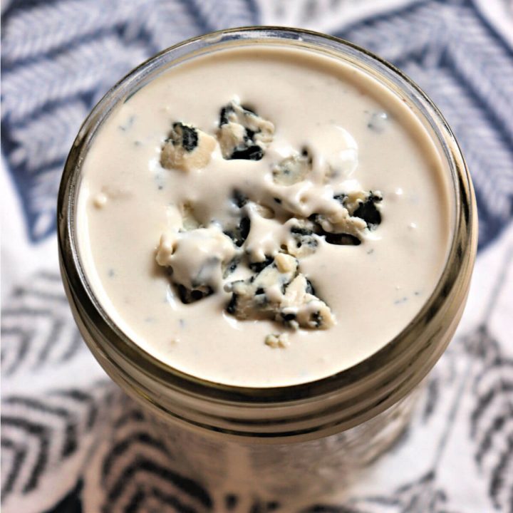 Chunky keto blue cheese dressing is easy to make homemade and store in a mason jar.