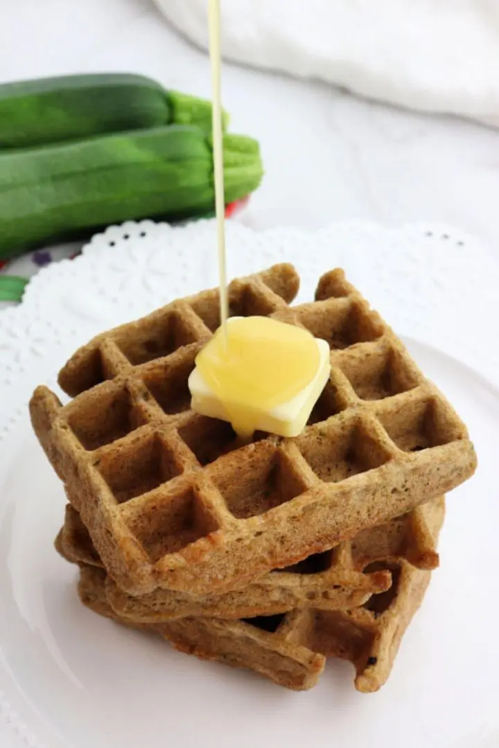 Syrup pouring on keto zucchini waffles