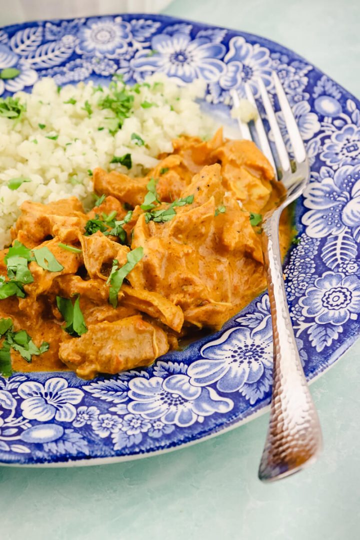 Plate of keto butter chicken with fork