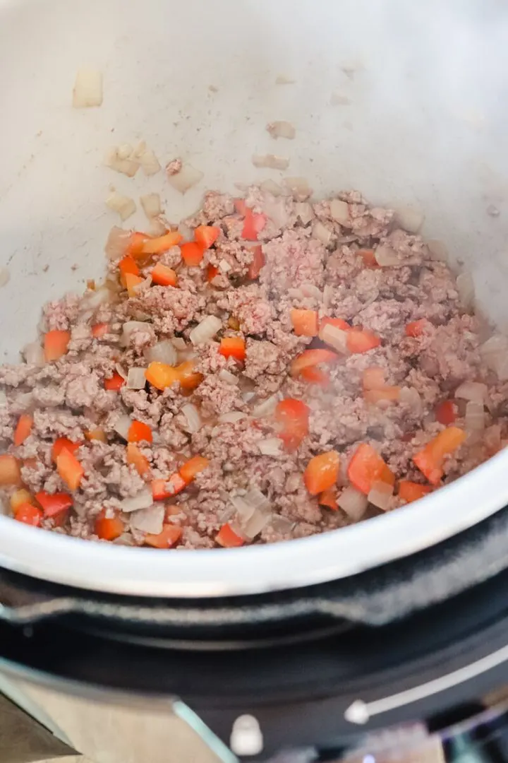 Beef, pepper, and onion cooking in an Instant Pot