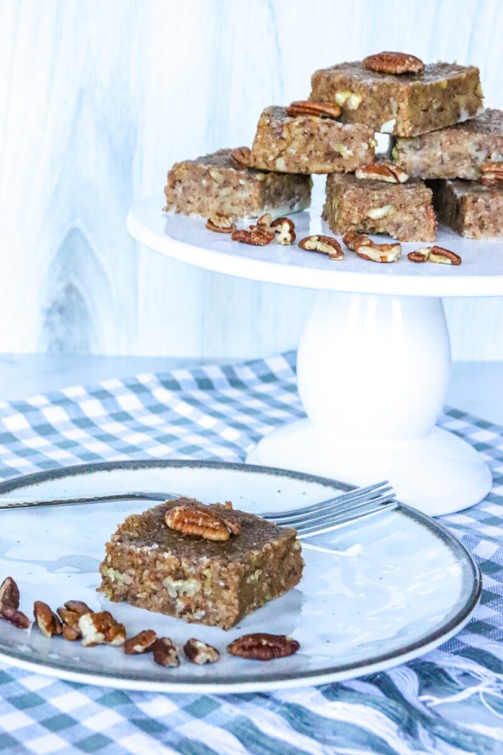 Keto pecan pie bars on white plates