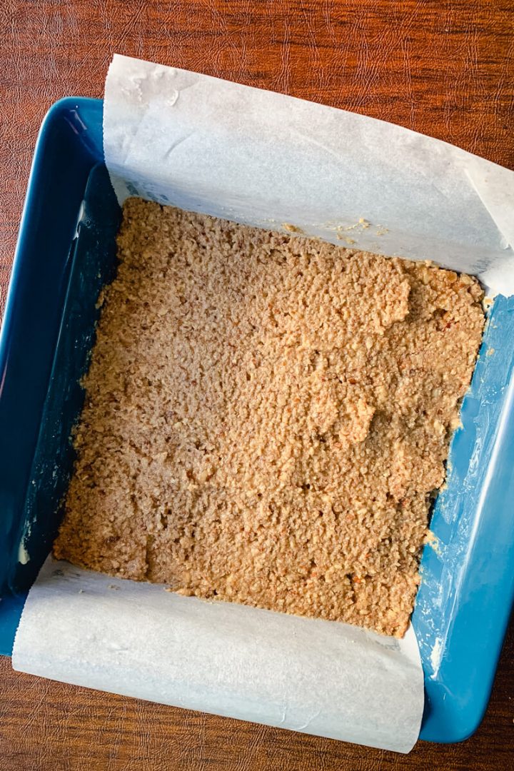 Keto pecan bars batter in a baking dish
