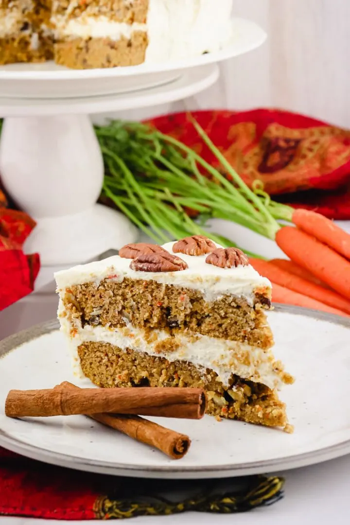 Piece of spiced keto carrot cake on a white plate